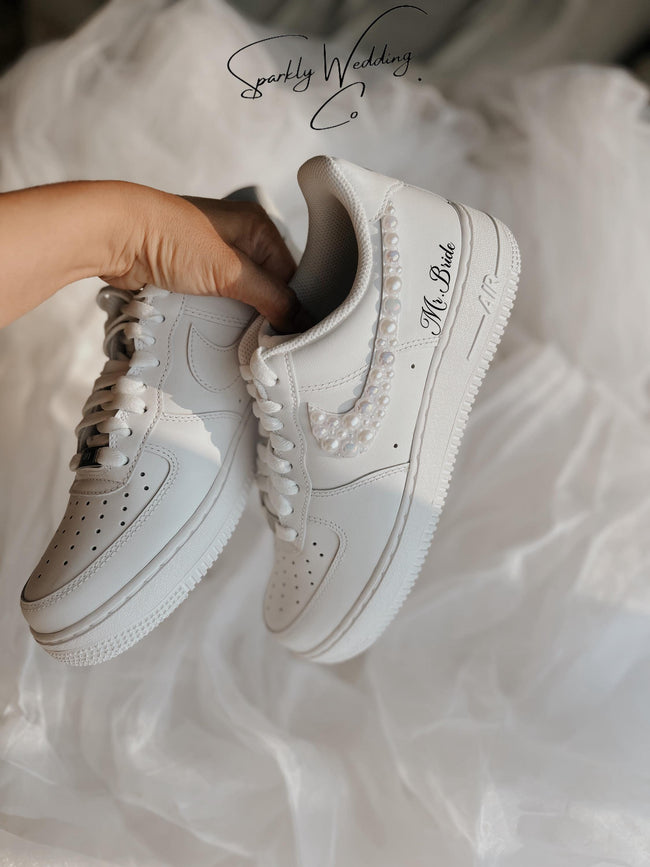 Custom Air Force 1 bridal sneakers featuring elegant white pearls on the outer swoosh, personalized wedding shoes for comfort