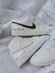 Side view of custom his and hers Air Jordan wedding sneakers for bride and groom