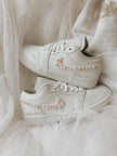 Top view of elegant white Air Jordan Low bridal sneakers designed for wedding day comfort and style.