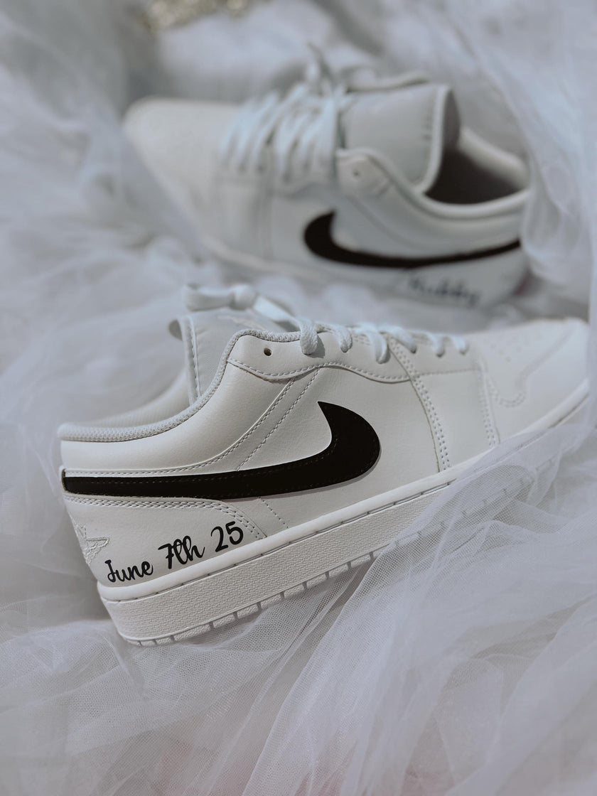 Side view of men’s Air Jordan Low wedding sneakers with black swoosh detailing