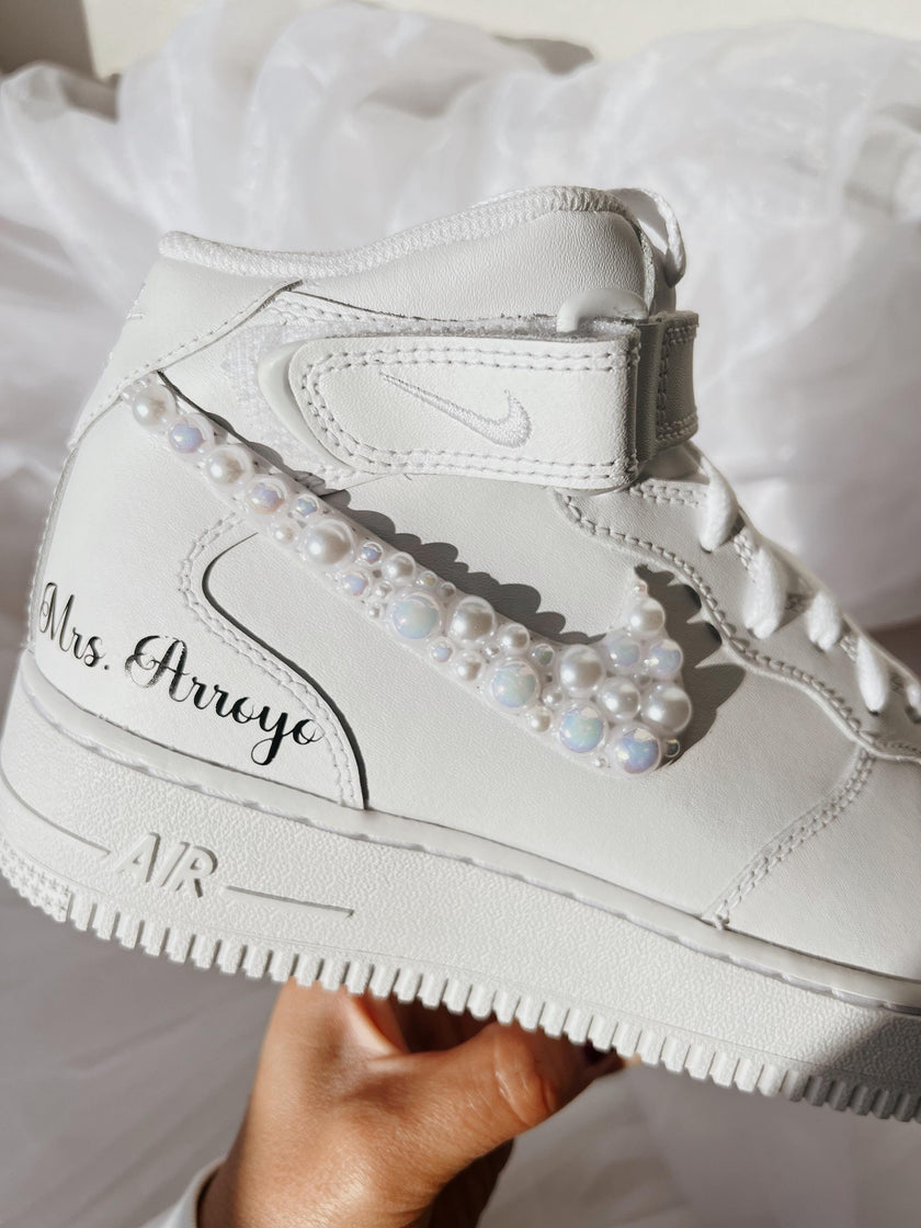 Handmade pearl bridal sneakers styled for a wedding flat lay