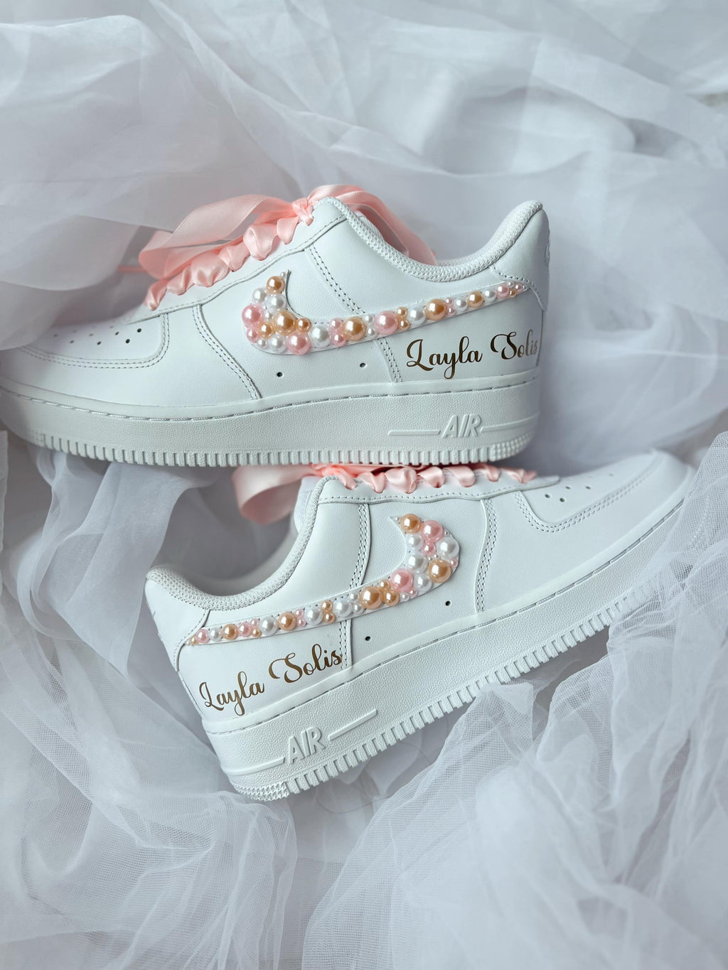 Handmade white bridal wedding sneakers with pearl accents styled for wedding day