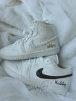 Side view of custom his and hers Air Jordan wedding sneakers for bride and groom