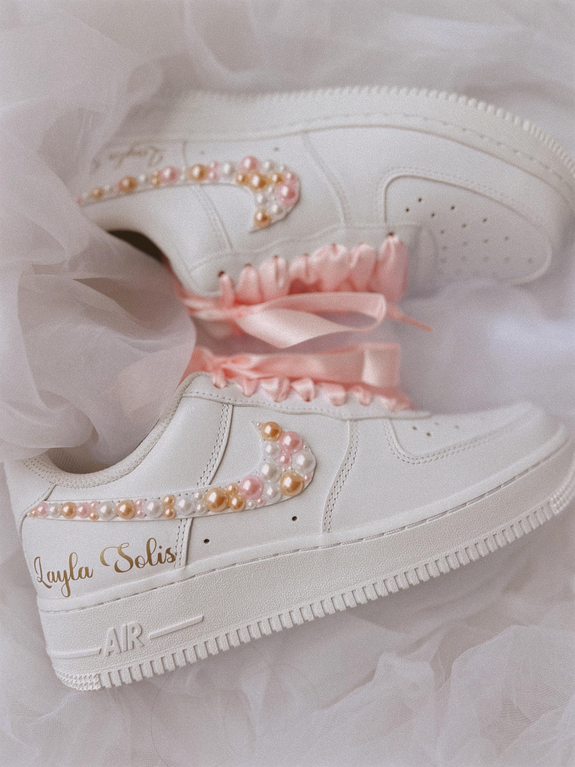 Close-up of pearl-embellished wedding sneakers for bride with custom detailing