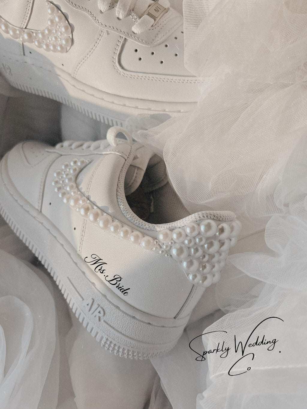 Detailed back view of bridal pearl wedding sneakers with pearl accents on the heel
