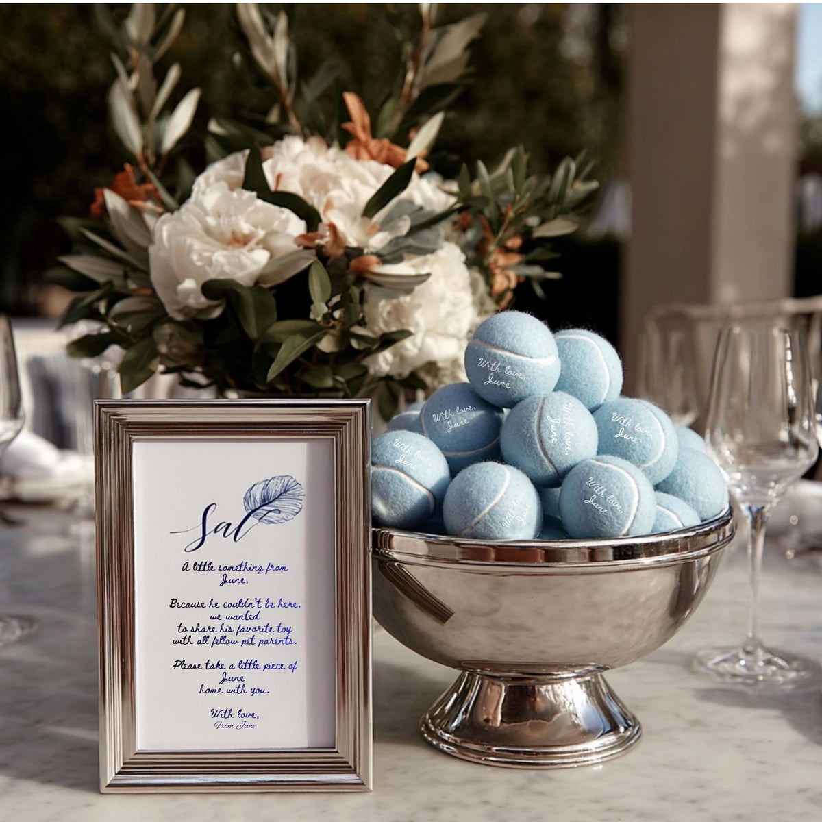 Close-up of custom text printed on tennis balls for wedding favors