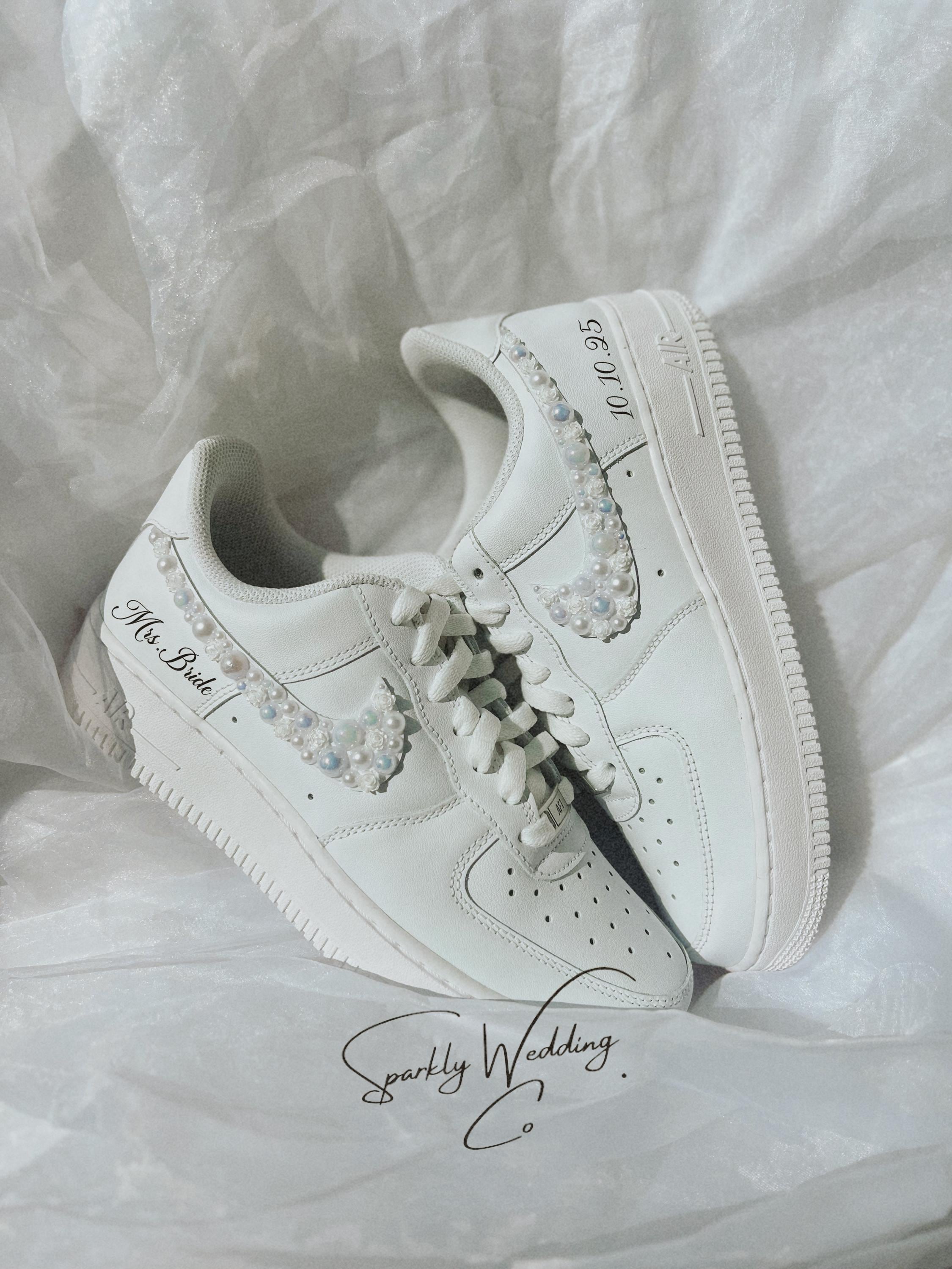 Personalized Nike Air Force 1 bridal wedding sneakers with pearls on both outer swooshes, customized with wedding name and date