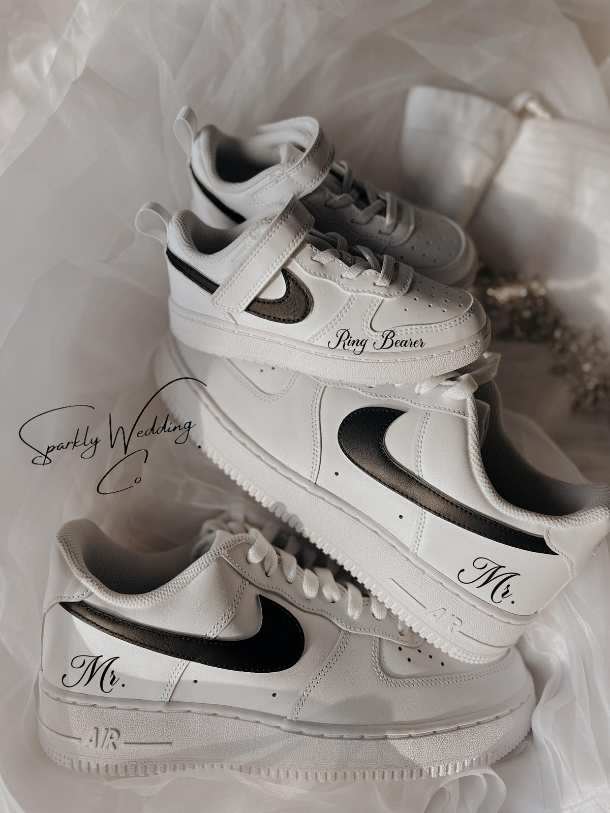 Custom black and white Nike Air Force 1 groom wedding sneakers with hand-painted outer swooshes, personalized with wedding name and date