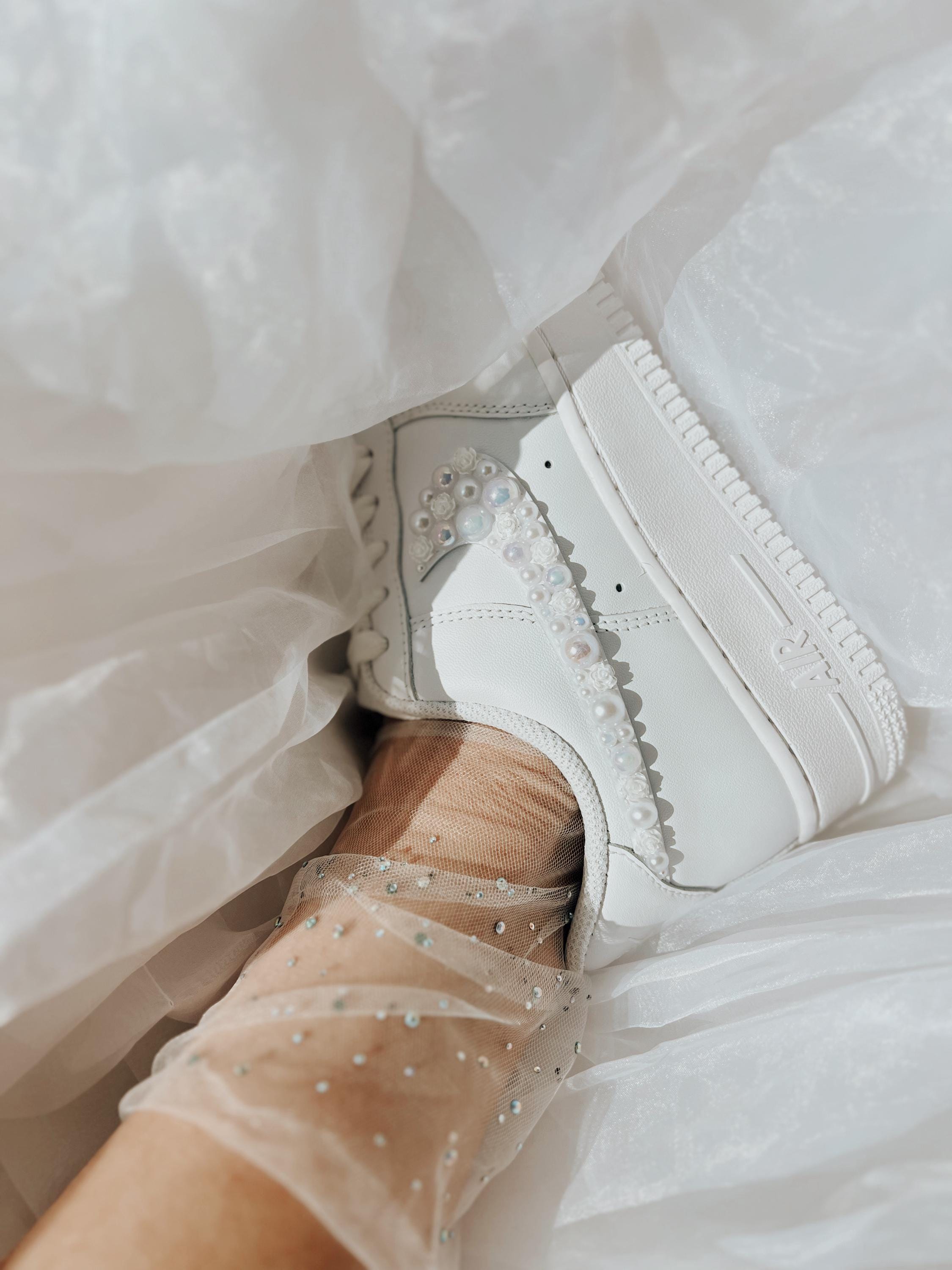Personalized Nike Air Force 1 bridal wedding sneakers with pearls on both outer swooshes, customized with wedding name and date