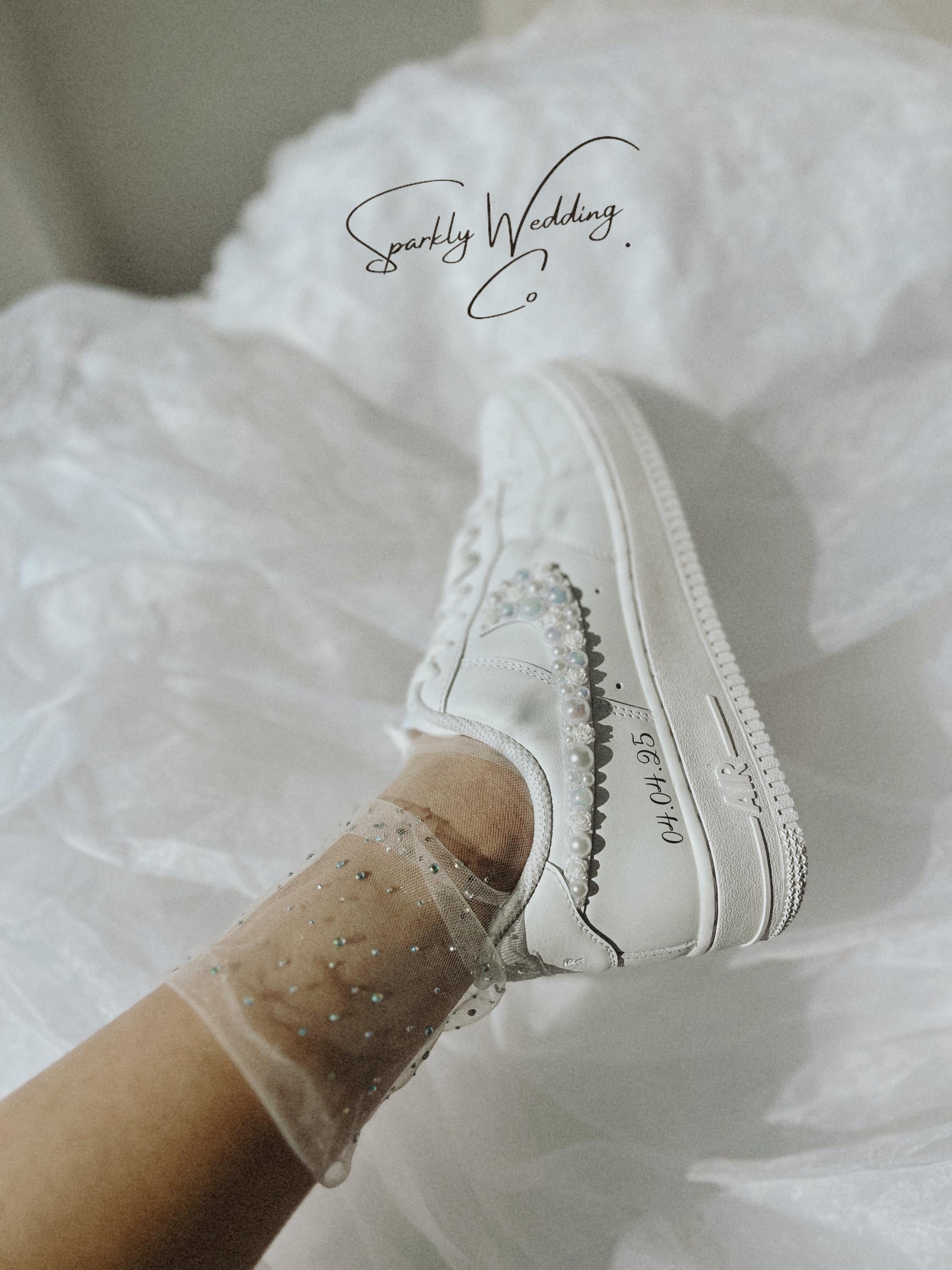 Personalized Nike Air Force 1 bridal wedding sneakers with pearls on both outer swooshes, customized with wedding name and date