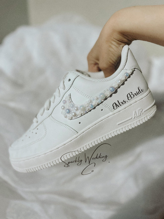 Personalized Nike Air Force 1 bridal wedding sneakers with pearls on both outer swooshes, customized with wedding name and date